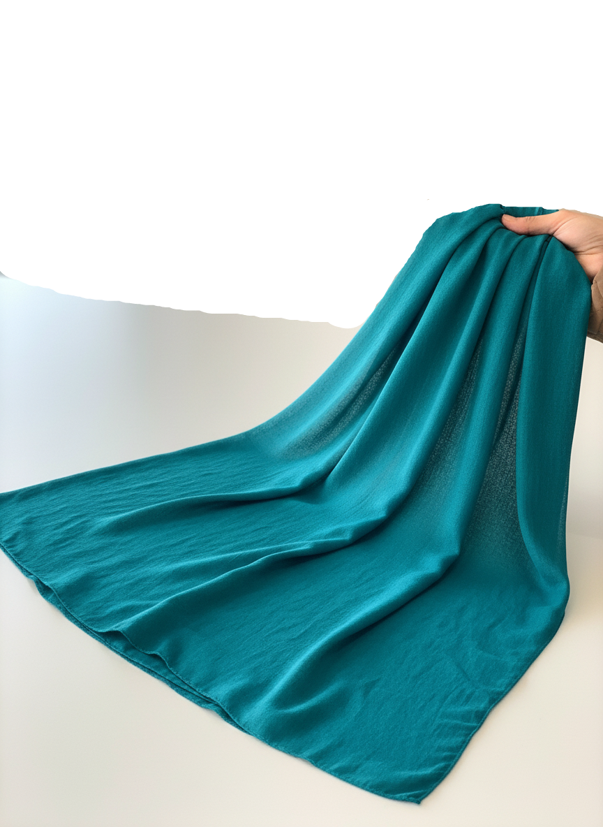 blue being held up on a white background