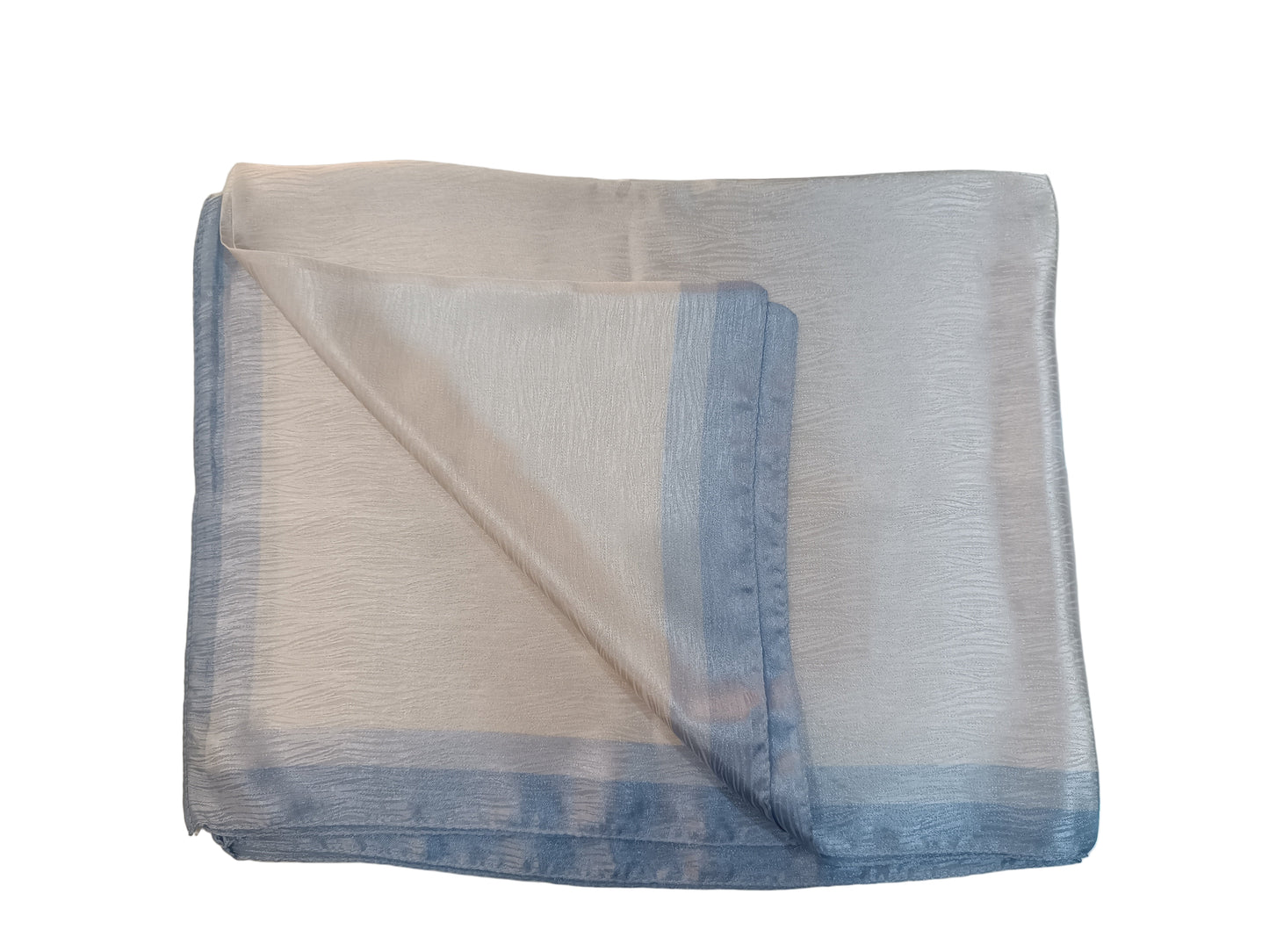 Folded white cloth with blue edges on a light gray surface