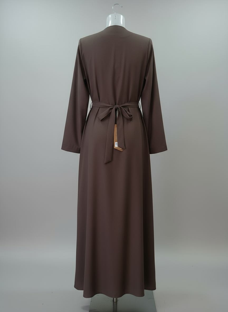 Brown dress on a mannequin against a plain background